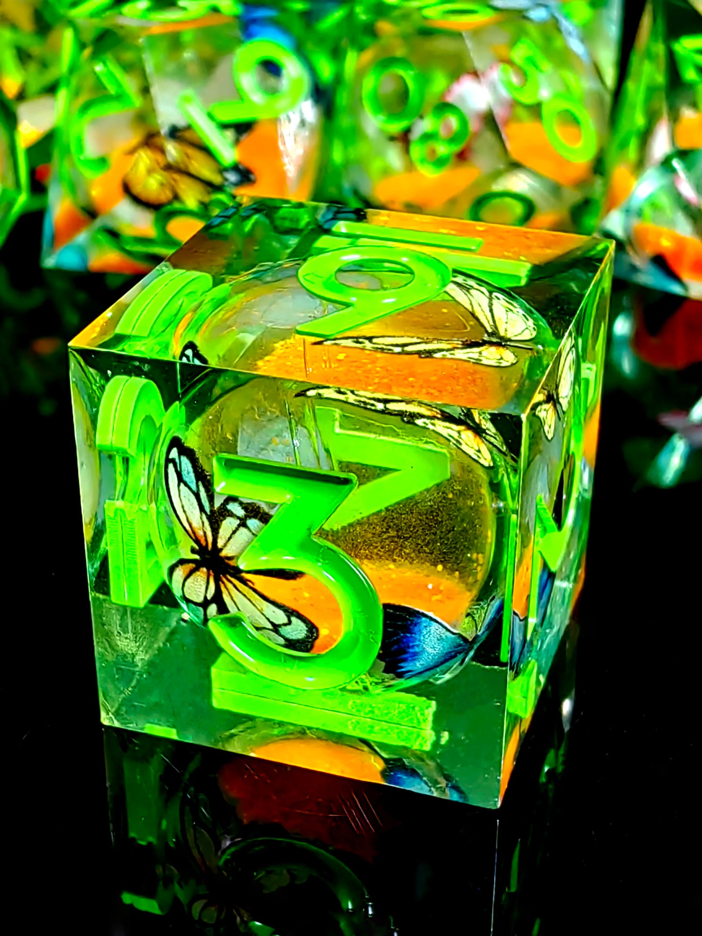 7 Piece Sharp Edge Resin Dice, Orange Sand Butterfly, Transparent with Green Numbers