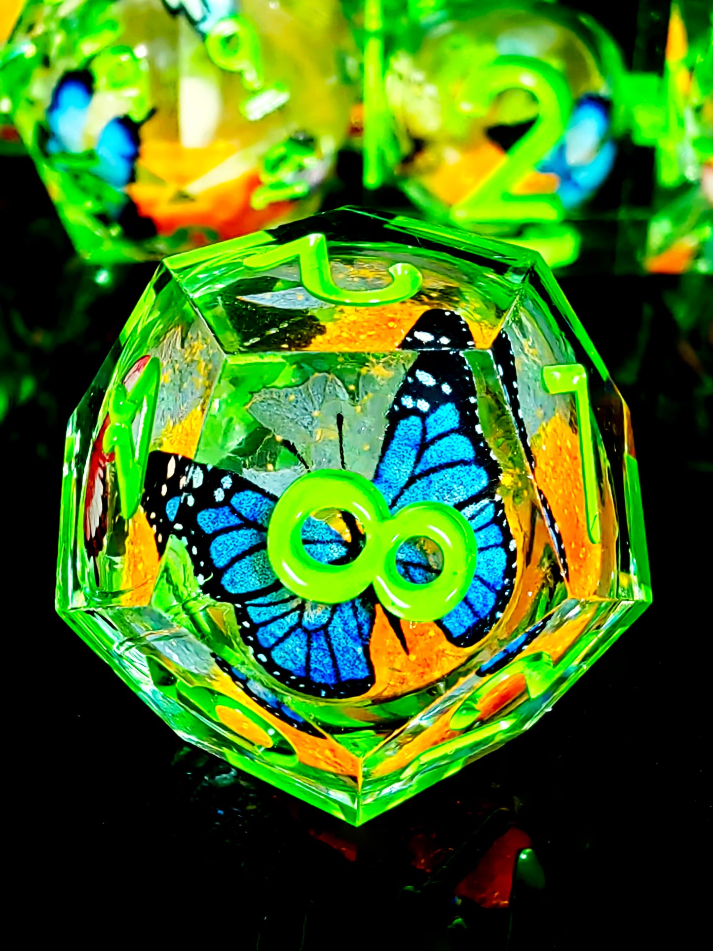 7 Piece Sharp Edge Resin Dice, Orange Sand Butterfly, Transparent with Green Numbers