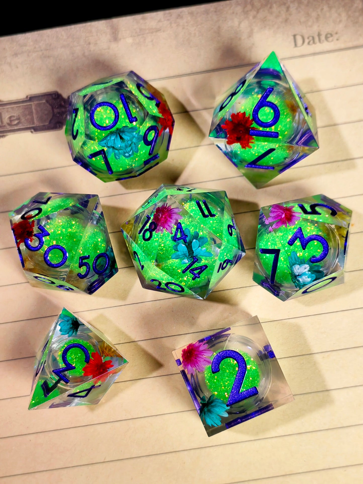 7 Piece Sharp Edge Resin Dice, Orange Sand Butterfly, Transparent with Green Numbers