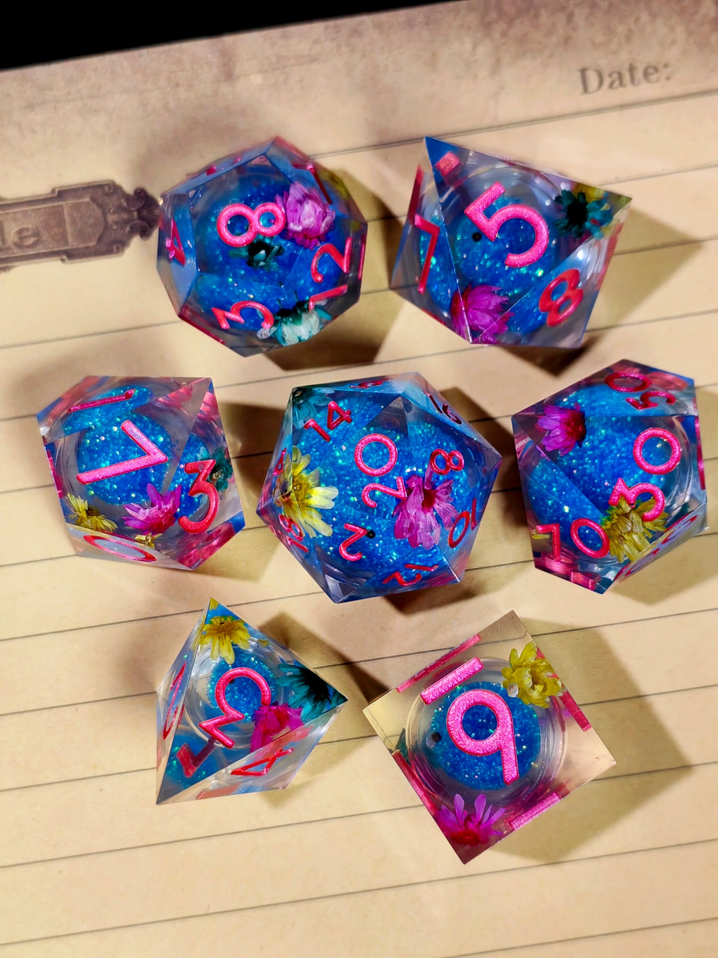 7 Piece Sharp Edge Resin Dice, Orange Sand Butterfly, Transparent with Green Numbers
