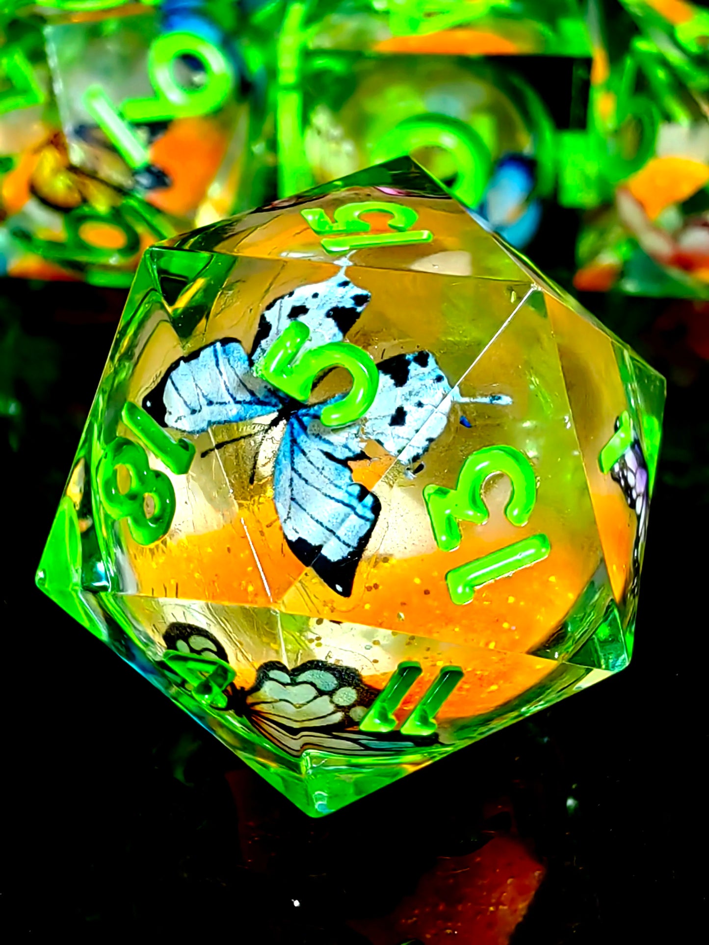 7 Piece Sharp Edge Resin Dice, Orange Sand Butterfly, Transparent with Green Numbers